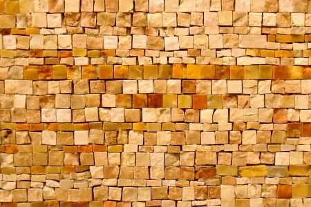 Small stone tiles in a mosaic pattern wall for textured backgroundの写真素材