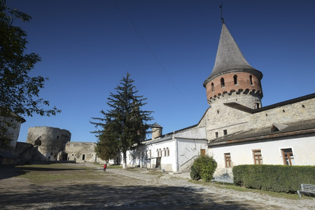 Inner courtyard and tower of Kamianets-Podilskyi castle in Western Ukraine. Shot on a beautiful...