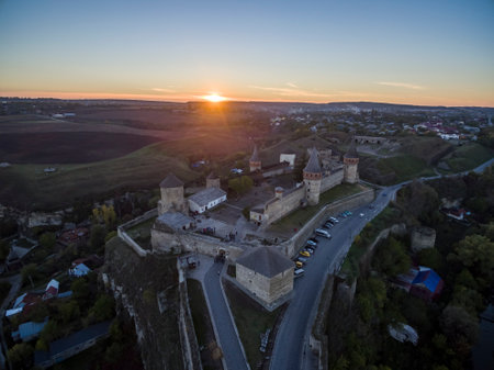 Aerial shot towards a sunset behind Kamianets-Podilskyi castle in Western Ukraine. Taken on a clear autumn eveningのeditorial素材