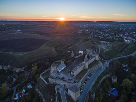 Aerial shot towards a sunset behind Kamianets-Podilskyi castle in Western Ukraine. Taken on a clear autumn eveningのeditorial素材