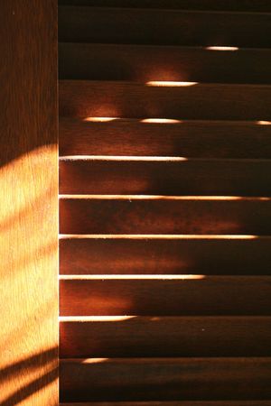 Brown shutters with dust in evening light.の写真素材