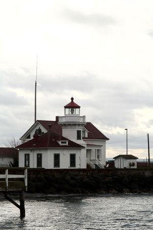 Light house on the shore of Puget Sound.の写真素材