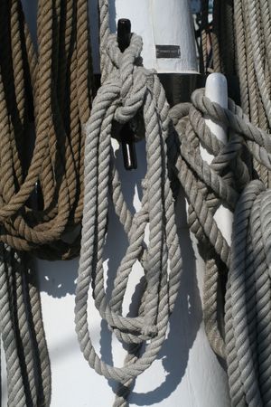 Line on a tall ship coiled and hanging on deck.の写真素材