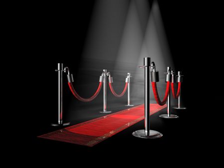 A red carpet with stanchions and spot lights.の写真素材