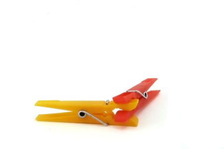 A  pair of plastic clothes pin isolated on white.の写真素材
