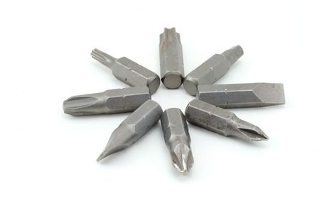 A group of drill heads organized and isolated on white.の写真素材