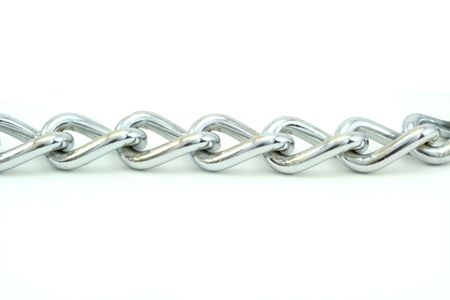 A silver chain un horizontally and isolated on white.の写真素材