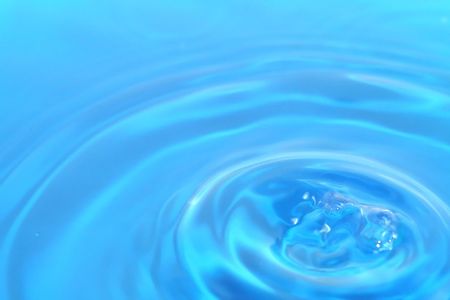 Blue water ripples emanating from one source.の写真素材