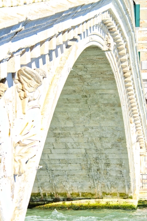 An empty bridge and canal in Veniceの写真素材