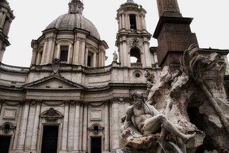 The fountain in front of a church in Piazza Navona, Rome.の写真素材