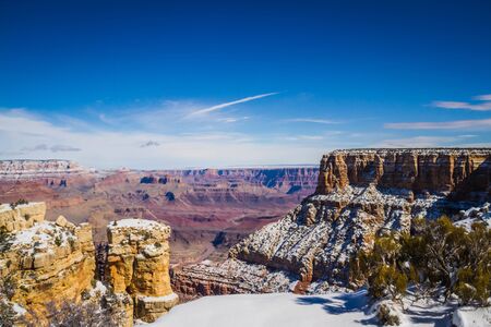 The Grand Canyon in winter with snow in the higher elevations.  This is an epic image taken from the Grand Canyon village in Grand Canyon National Park in Arizona, USA.の写真素材