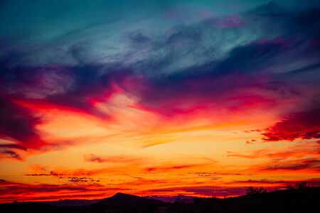 A sunset over the Sonoran Desert of Arizona with high altitude clouds.の写真素材