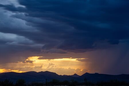 A sunset image of a monsoon in the Sonoran desert of Arizona.の写真素材