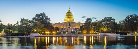 Panoramic image of the Capitol of the United States with the capitol reflecting pool in morning light.の写真素材