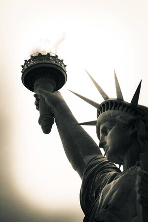 Looking up at the Statute of Liberty with a neutral background.の写真素材