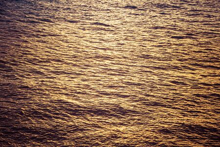 Ocean water texture from above in evening light.の写真素材