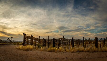 Panorama of an old western corral in the desert of Arizona in late afternoon light.の写真素材
