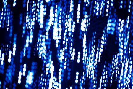 Abstract background of blue lights with the bokeh effect.の写真素材