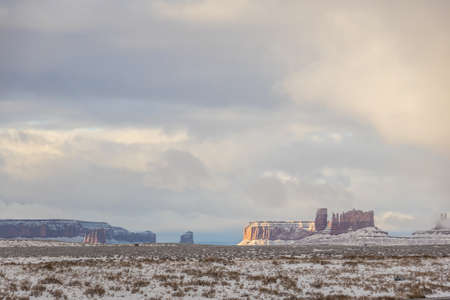 Classic southwest desert landscape with snow on the ground in Monument Valleyin Arizona and Utah.の写真素材