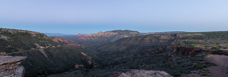 The red rocks, green valleys, and blue skies of a morning over the city of Sedona, Arizona in early...