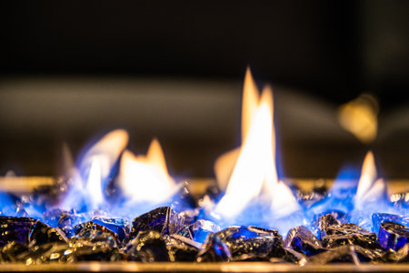 A close-up of the flames in a home fire pit in long exposure.