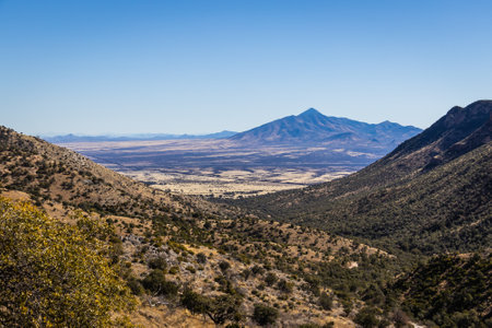 The border between the United States and Mexico as viewed from a distance through a valley.の写真素材
