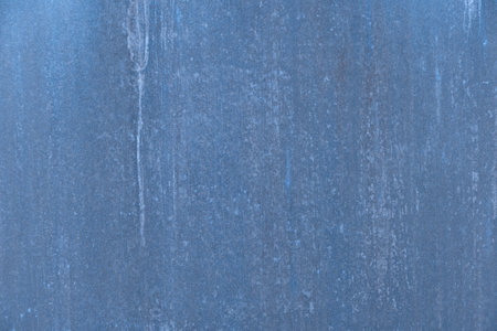 Blue colored abstract textured background that is heavily weathered.