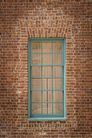 Close up of the color windows of a colonial era home in Charleston, South Carolina