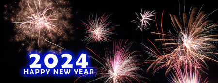 A banner with 2024 Happy New Year with fireworks on a black background.の写真素材