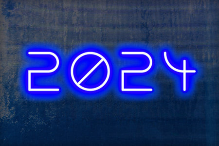 The date 2024 in glowing numbers on a textured background for New Years.の写真素材