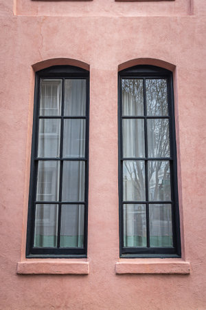 Close up of the color windows of a colonial era home in Charleston, South Carolina