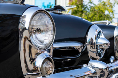 Close up detail of a shiny old classic car in natural light.