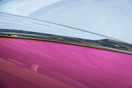 Abstract background detail of the paint job of a classic car in natural light.の写真素材