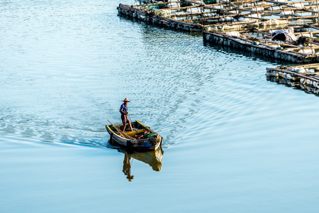 18 August 2016, a fisherman is working in the beautiful coastal intertidal zone of huyuao village at Xiapu county of Fujian province.のeditorial素材