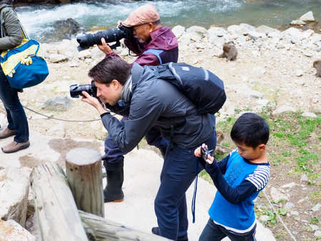 Japan, 2015. three generations of photographers with matching camera's for their age.のeditorial素材