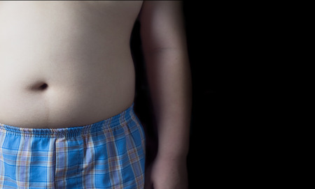 fat boy isolated on black background.