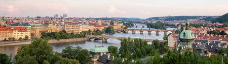 PRAGUE, CZECH REPUBLIC - JULY 5, 2017: Aerial panoramic view of famous bridges in Old Town of Prague in Czech Republic over Vltava river before the sunset.のeditorial素材
