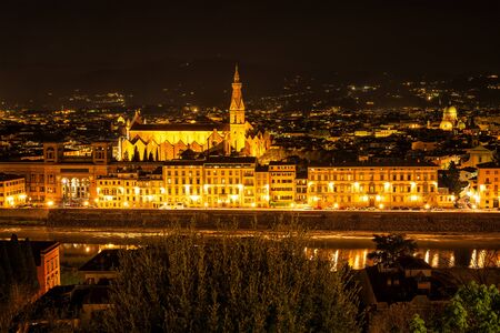 Florence, Italy - April 7, 2019: Amazing night view of Florence city, Italy with the river Arno and Basilica of Santa Croce.のeditorial素材
