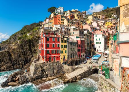 Riomaggiore, Italy - April 5, 2019: Beautiful view of Riomaggiore - one of five famous colorful villages of Cinque Terre National Park in Italy, Liguria region.のeditorial素材