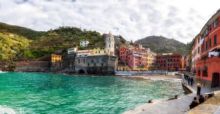 Vernazza, Italy - April 5, 2019: Beautiful view of Vernazza - one of five famous colorful villages of Cinque Terre National Park in Italy, Liguria region.のeditorial素材