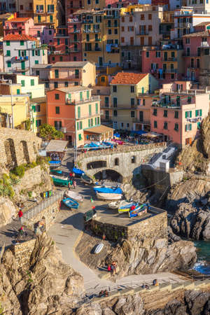 Manarola, Italy - April 5, 2019: Beautiful close up view of Manarola - one of five famous colorful...