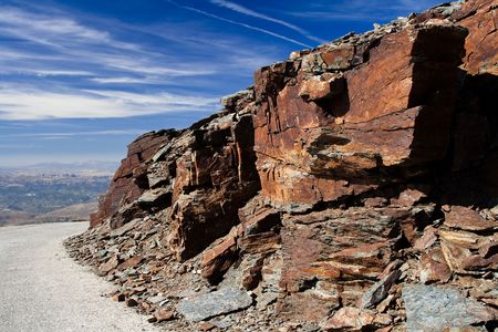 Big rock structures arise on the way. Nice sky color and cloud patterns.の写真素材