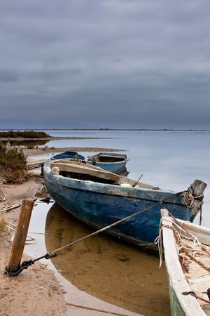 This boats are moored while storm is coming from horizon.の写真素材