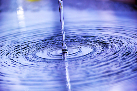 Water flows on the mirror surfaceの写真素材