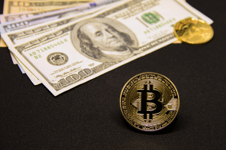 Bitcoin with dollars and golden coinの写真素材