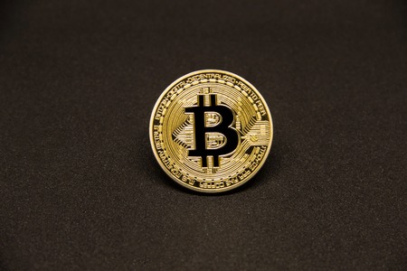Bitcoin with dollars and golden coin