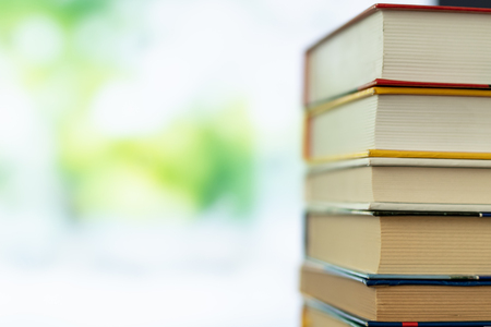 Book stack in the library room and blurred trees on street back to school concept for business and education background, back to school conceptの写真素材