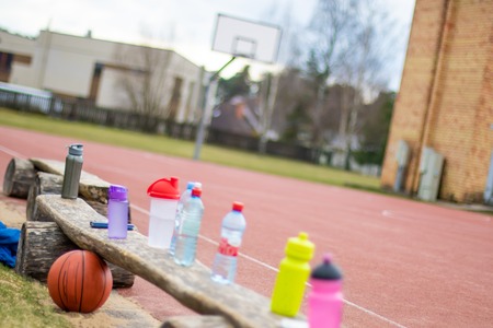 Drinking water concept, water bottles on basketball court healthy life conceptの写真素材