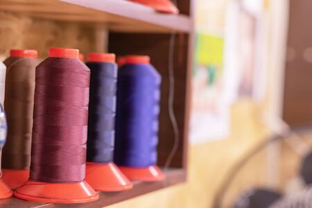 Colorful thread spools used in fabric and textile industry for shoes makingの写真素材