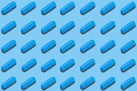Seamless pattern with blue pills on blue background. Medicine health pharmacy pharmacology concept.の写真素材